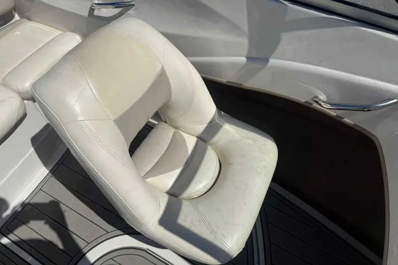 Slide: The Image of White leather seat in a 2008 Tahoe Q5i Sport boat, with sleek interior design. - 11
