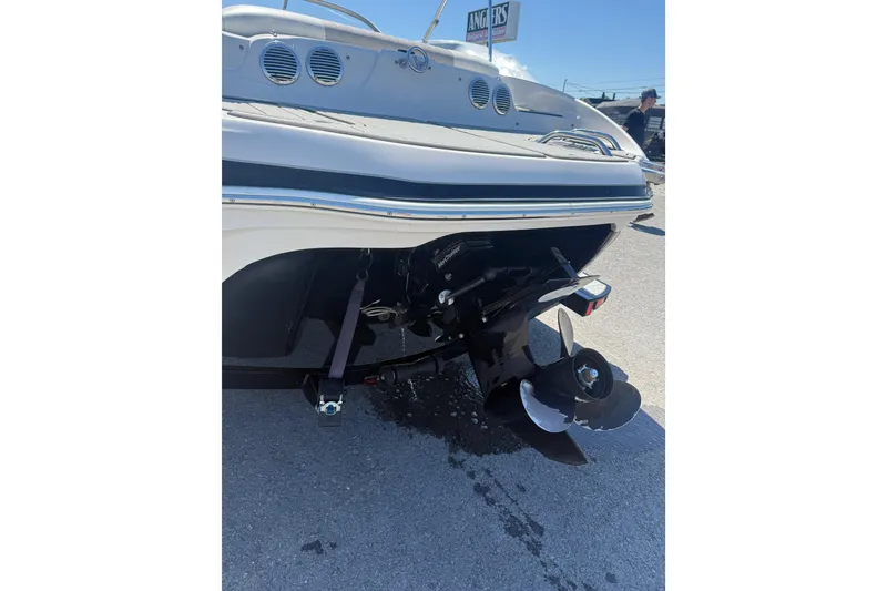 Slide: The Image of 2008 Tahoe Q5i Sport boat rear view with propeller and outboard motor. - 5