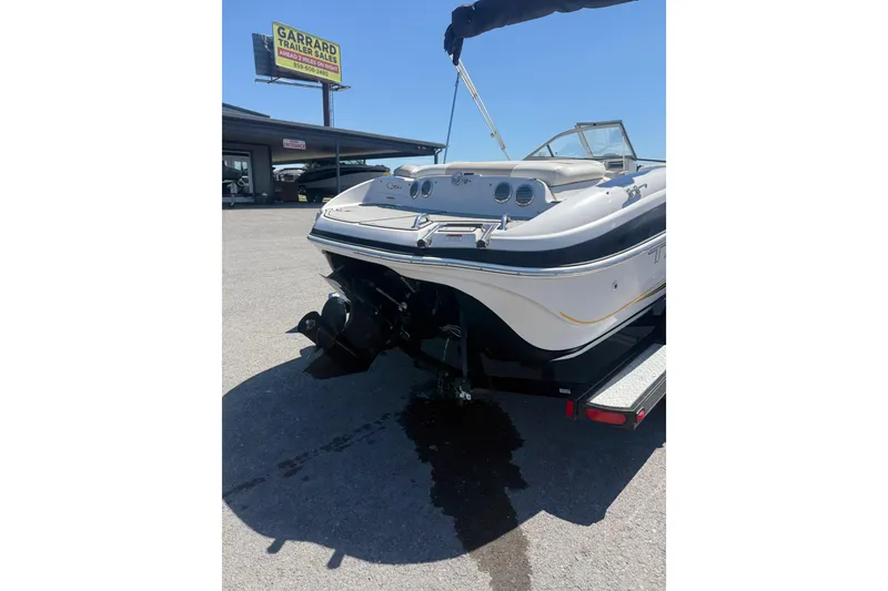 Slide: The Image of 2008 Tahoe Q5i Sport boat on trailer at dealership, rear view. - 8