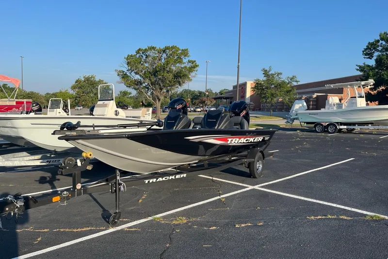 The Image of 2026 Tracker Pro Team 190 boat on trailer in parking lot. - 0