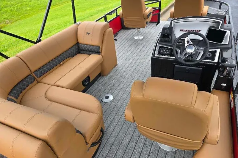 Slide: The Image of Luxurious interior of 2026 Ranger 220F boat with tan seating and modern dashboard. - 7