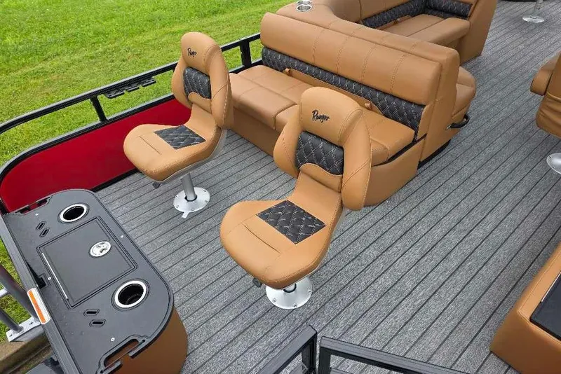 Slide: The Image of 2026 Ranger 220F boat interior with tan seating and modern design. - 6