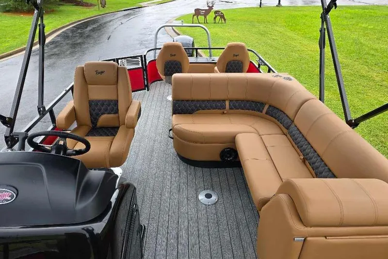 Slide: The Image of 2026 Ranger 220F boat interior with tan leather seating and modern design. - 5