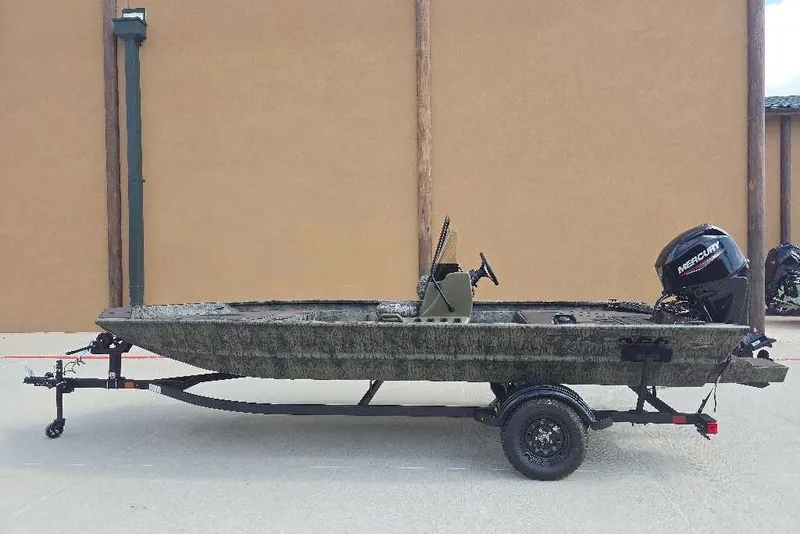 The Image of 2026 Tracker Grizzly 1860 CC boat on trailer, side view, outdoors. - 0