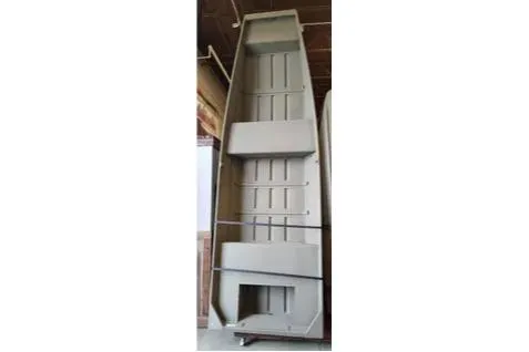 The Image of 2026 Tracker Grizzly 14 Jon boat displayed vertically in a showroom. - 0