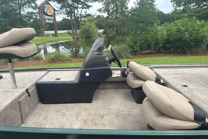 Slide: The Image of 2026 Tracker Bass Tracker Classic Limited boat interior with beige seats near Outdoor World. - 5
