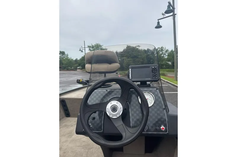 Slide: The Image of Steering console of 2026 Tracker Bass Tracker Classic Limited boat with navigation equipment. - 7