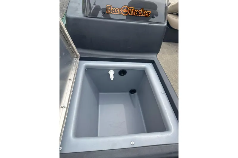 Slide: The Image of 2026 Tracker Bass Tracker Classic Limited livewell, open lid, gray interior, logo visible. - 8