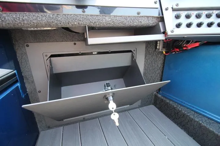 Slide: The Image of Interior of 2026 Vexus ADX 190 showing a secure storage compartment with key lock. - 11