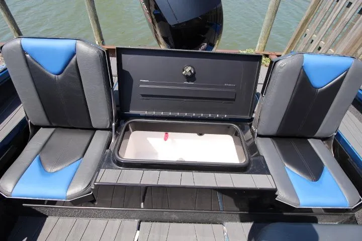 Slide: The Image of 2026 Vexus ADX 190 boat interior with blue and black seats and storage compartment. - 13
