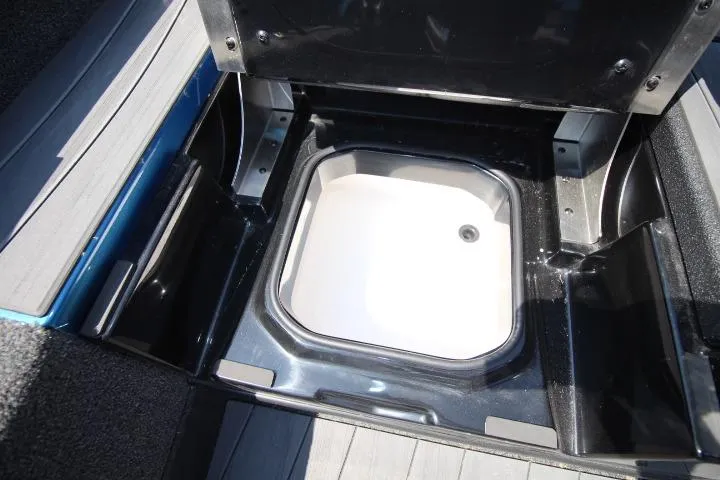 Slide: The Image of Open storage compartment in 2026 Vexus ADX 190 boat, showcasing interior design. - 14