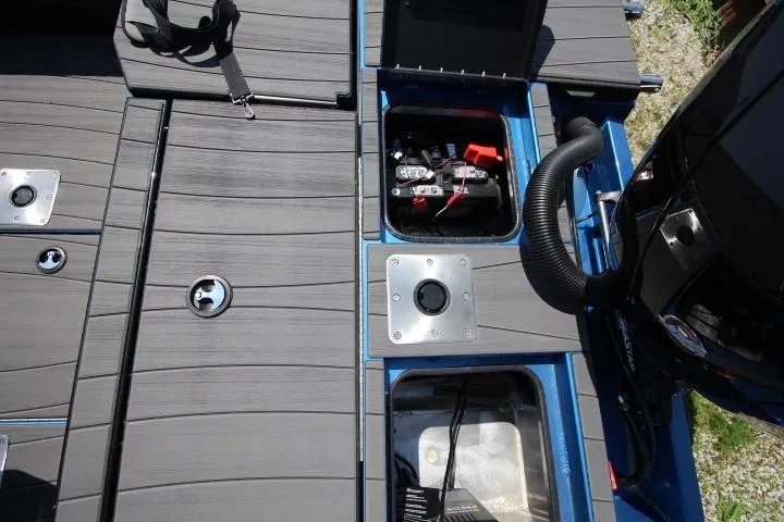 Slide: The Image of 2026 Vexus ADX 190 boat deck with storage compartments and engine components. - 15