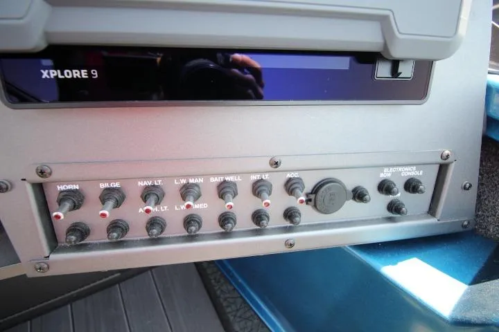 Slide: The Image of Control panel of 2026 Vexus ADX 190 boat with switches and Xplore 9 display. - 17