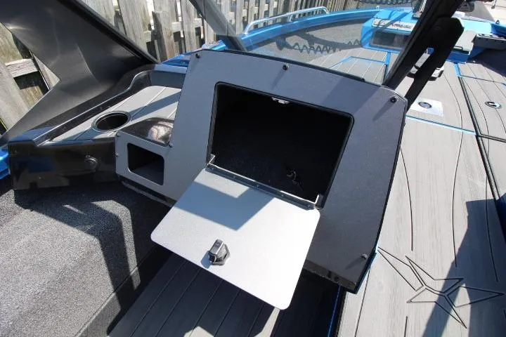 Slide: The Image of 2026 Vexus ADX 190 boat interior with open storage compartment and sleek design. - 19