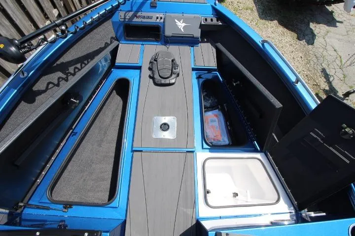 Slide: The Image of 2026 Vexus ADX 190 boat interior with storage compartments and sleek design. - 22