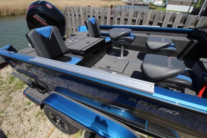 Slide: The Image of 2026 Vexus ADX 190 boat with blue exterior and comfortable seating. - 6