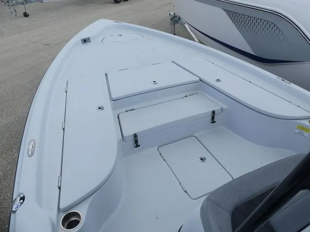 Slide: The Image of 2021 Blue Wave 2300 Pure Bay boat deck with storage compartments. - 12