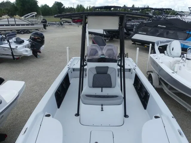 Slide: The Image of 2021 Blue Wave 2300 Pure Bay boat in a parking lot. - 13