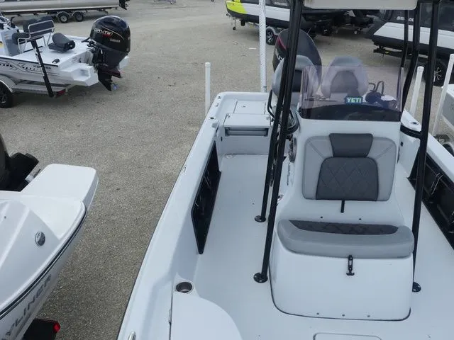 Slide: The Image of 2021 Blue Wave 2300 Pure Bay boat in a parking area. - 14