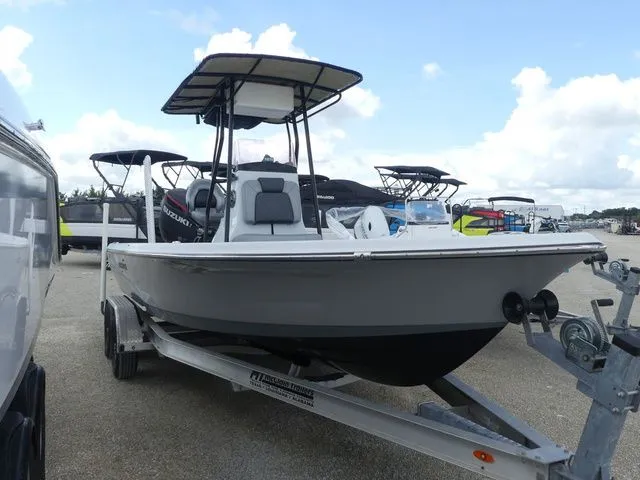Slide: The Image of 2021 Blue Wave 2300 Pure Bay boat on trailer outdoors. - 3