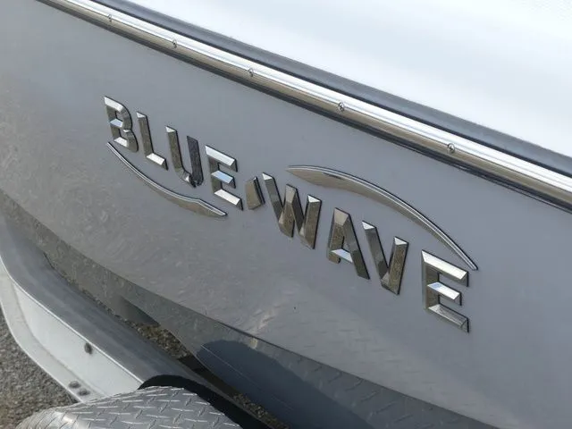 Slide: The Image of Close-up of Blue Wave 2300 Pure Bay boat logo, 2021 model. - 7