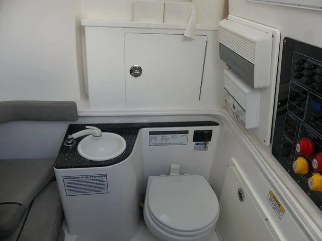 Slide: The Image of Interior of 2021 Sea Fox 328 Commander with toilet and sink. - 23