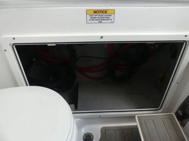Slide: The Image of Access panel of 2021 Sea Fox 328 Commander with warning notice. - 27