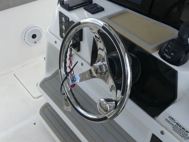 Slide: The Image of Steering console of 2021 Sea Fox 328 Commander with shiny wheel. - 37