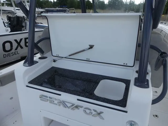 Slide: The Image of 2021 Sea Fox 328 Commander with open storage compartment lid. - 44