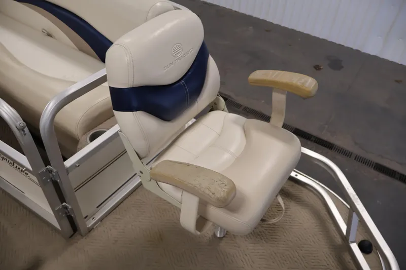 Slide: The Image of 2008 Sun Tracker Party Barge 24 DLX boat seat with beige and blue upholstery. - 12
