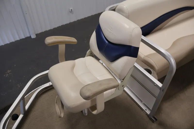 Slide: The Image of 2008 Sun Tracker Party Barge 24 DLX boat seat with beige and blue upholstery. - 13