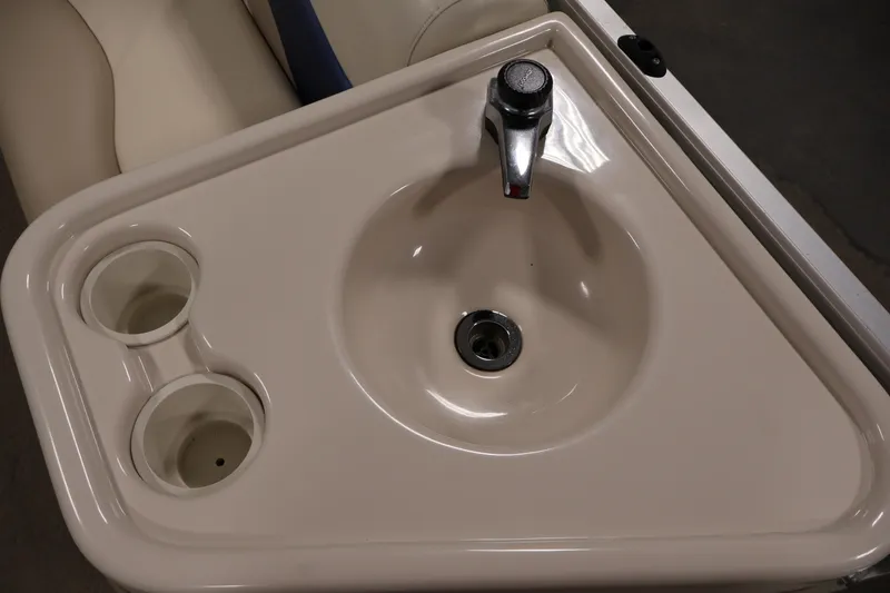 Slide: The Image of Sink and cup holders on 2008 Sun Tracker Party Barge 24 DLX boat. - 17