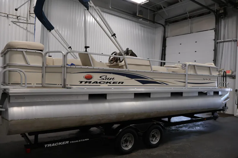 Slide: The Image of 2008 Sun Tracker Party Barge 24 DLX pontoon boat in indoor storage. - 2