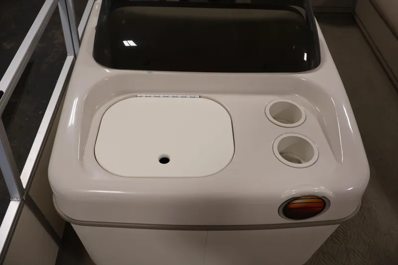 Slide: The Image of 2008 Sun Tracker Party Barge 24 DLX console with cup holders and storage compartment. - 21