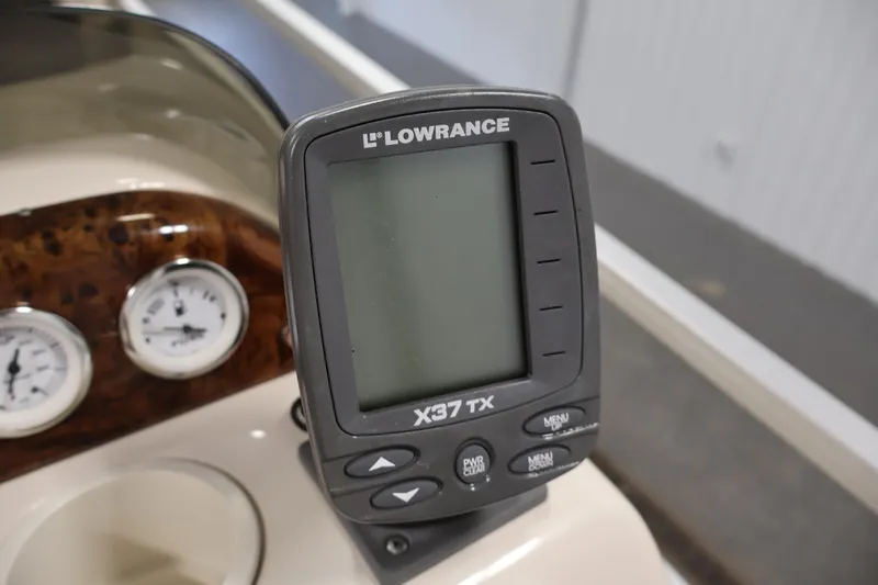 Slide: The Image of Lowrance X37 TX fish finder on 2008 Sun Tracker Party Barge 24 DLX dashboard. - 25