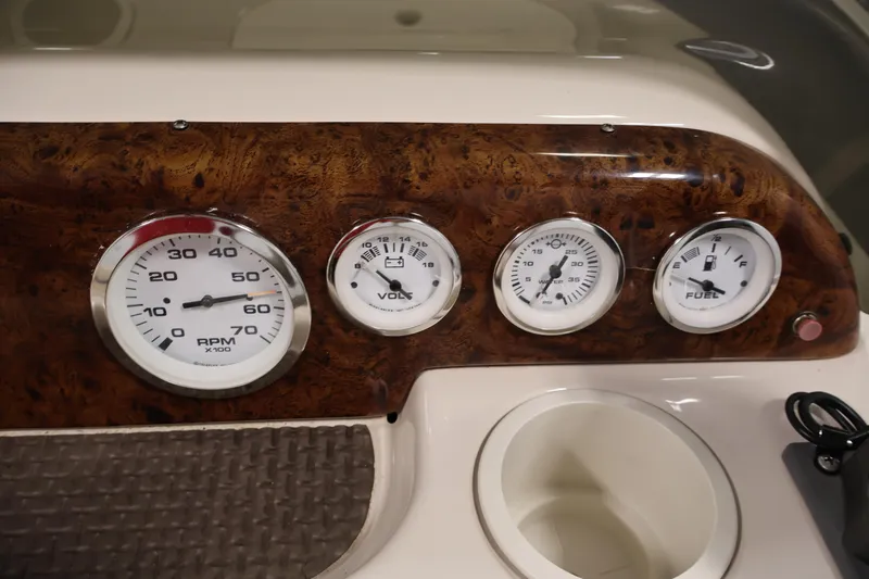 Slide: The Image of Dashboard of a 2008 Sun Tracker Party Barge 24 DLX with RPM, volt, and fuel gauges. - 26