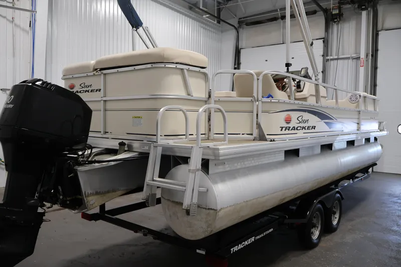 Slide: The Image of 2008 Sun Tracker Party Barge 24 DLX pontoon boat in a garage setting. - 3