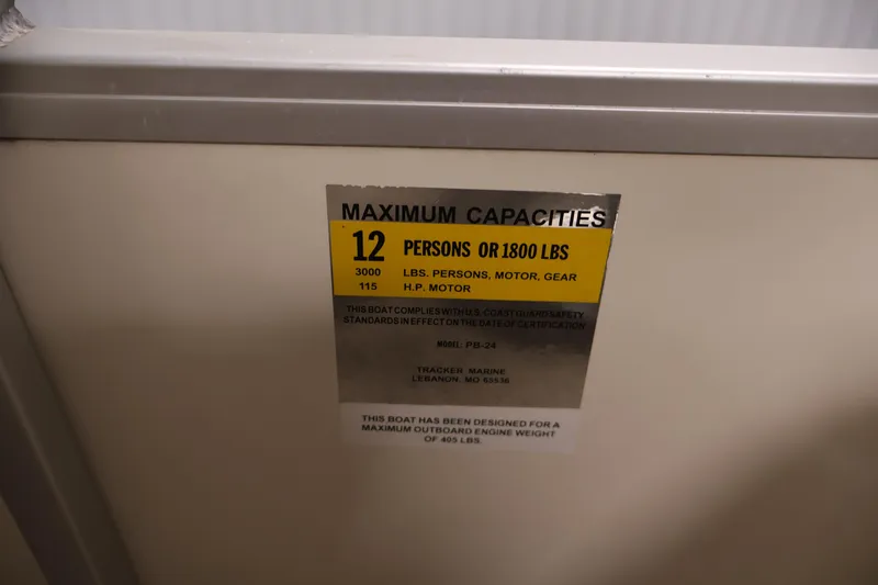 Slide: The Image of Capacity label on 2008 Sun Tracker Party Barge 24 DLX, indicating 12 persons or 1800 lbs. - 31