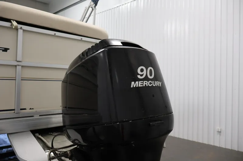 Slide: The Image of 2008 Sun Tracker Party Barge 24 DLX with 90 Mercury outboard motor in storage. - 38