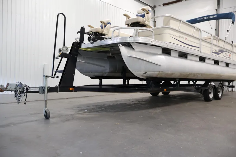 Slide: The Image of 2008 Sun Tracker Party Barge 24 DLX pontoon boat on trailer in indoor storage. - 44