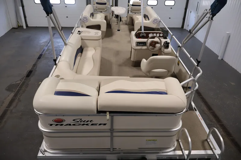 Slide: The Image of 2008 Sun Tracker Party Barge 24 DLX pontoon boat interior with seating and helm. - 7