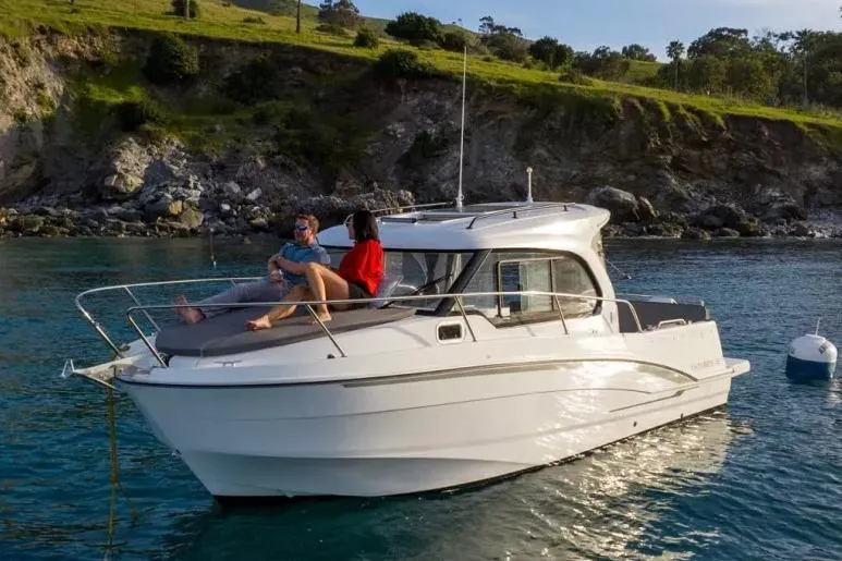 The Image of 2026 Beneteau Antares 8 boat near rocky coastline. - 0