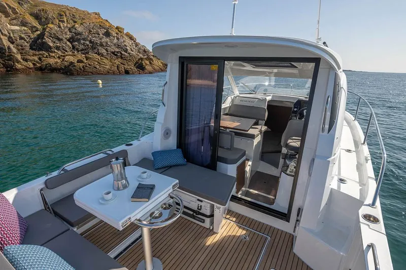 Slide: The Image of Beneteau Antares 8 2026 on calm waters with cozy deck area. - 4