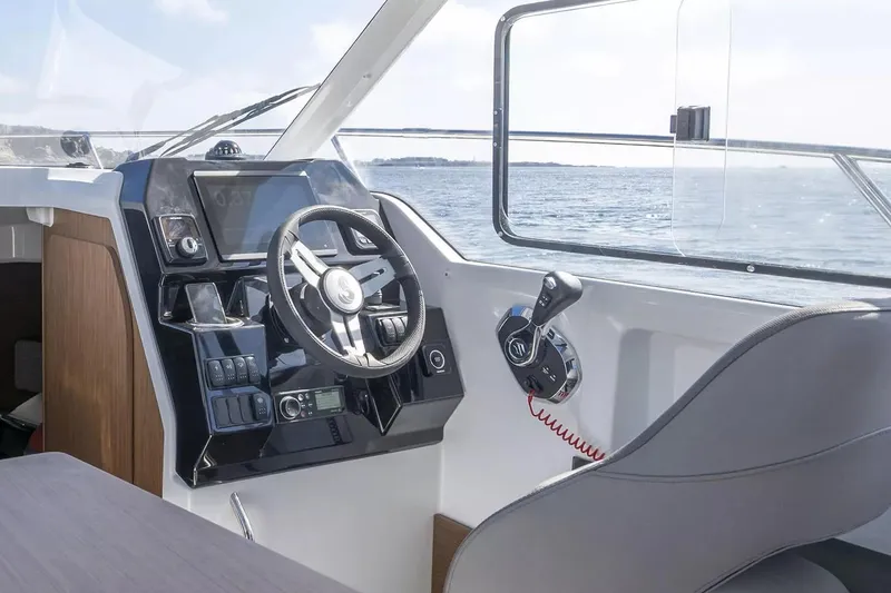 Slide: The Image of Interior of 2026 Beneteau Antares 8 with helm console. - 8