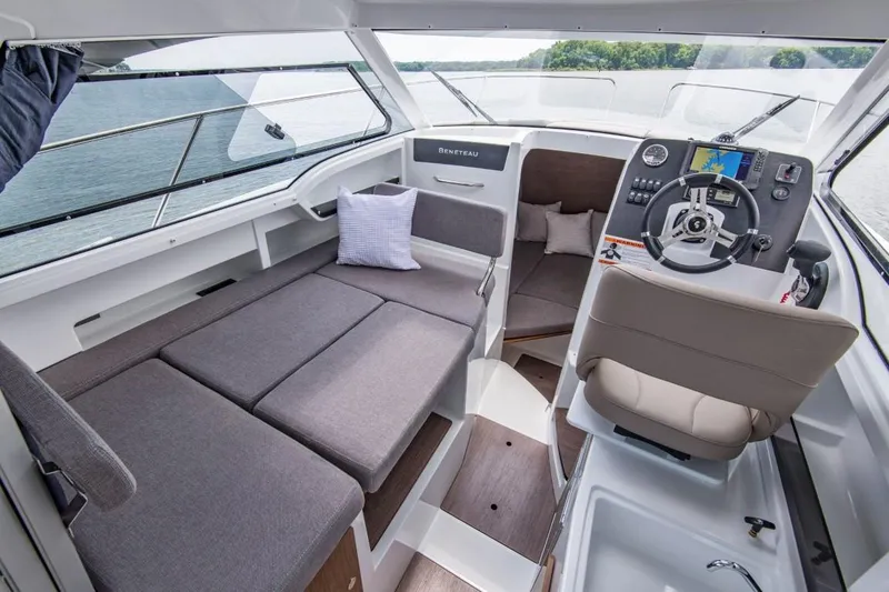 Slide: The Image of Interior of 2024 Beneteau Antares 8 boat with seating and helm station. - 9