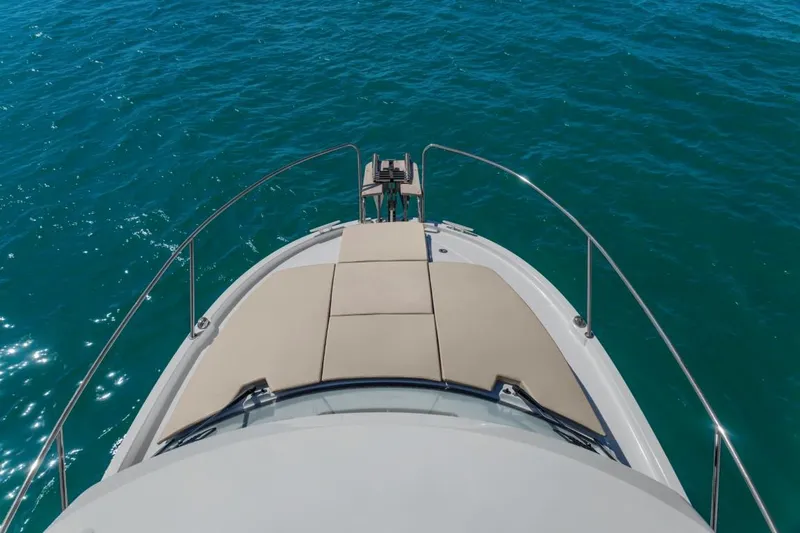 Slide: The Image of 2024 Beneteau Antares 8 boat bow on open water. - 3