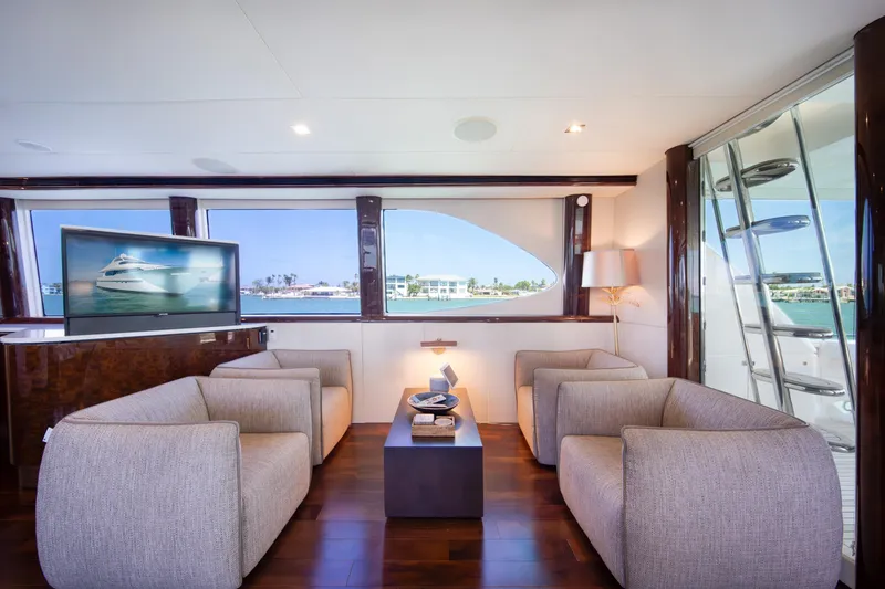 Slide: The Image of Luxurious interior of 2001 Lazzara 94 yacht with modern seating and large windows. - 11