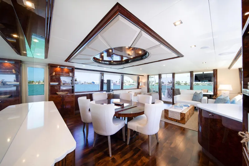 Slide: The Image of Luxurious interior of 2001 Lazzara 94 yacht with elegant dining and seating area. - 12