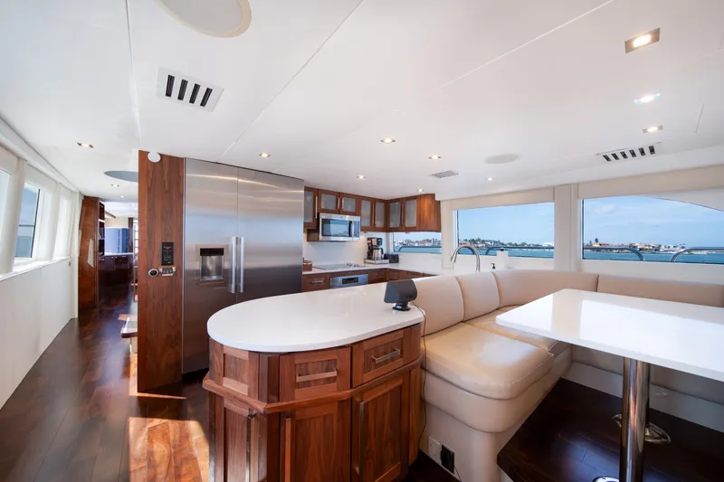 Slide: The Image of Luxurious interior of 2001 Lazzara 94 yacht with modern kitchen and seating area. - 14