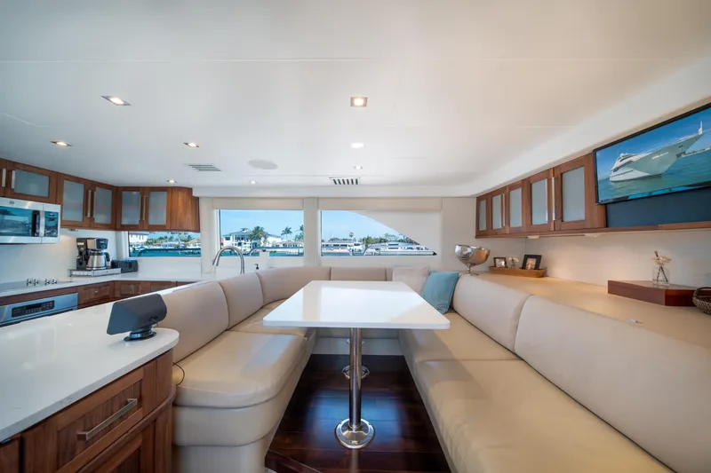 Slide: The Image of Luxurious interior of 2001 Lazzara 94 yacht with modern kitchen and elegant seating area. - 16